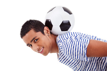 handsome latin boy holding a soccer ball