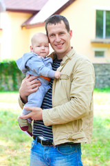 Fototapeta premium Father's love. Cute baby with father.