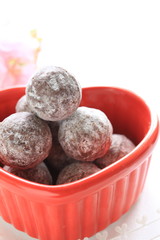 Homemade Truffes and roses on white background