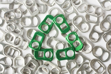 recycle sign from green soft-drink tab on aluminum pull ring
