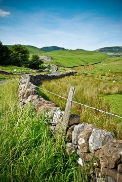 Yorkshire Dales Stone Wall With Bright Blue Sky