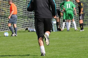 Obraz premium le soigneur au football