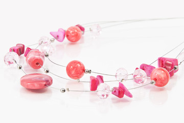 jewellery from red beads on glass