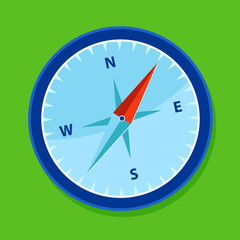 blue compass in green background
