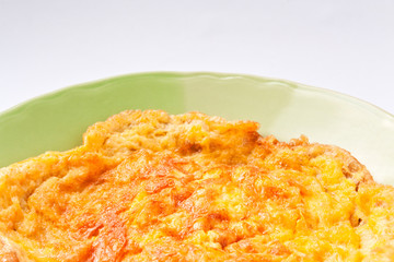 Omelette in a green dish