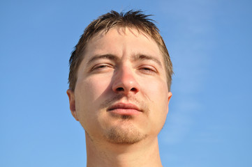Fototapeta premium The young man looked thoughtfully at the camera, portrait