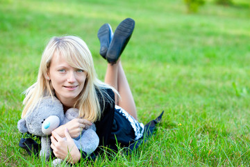 .Girl relaxing on the meadow against