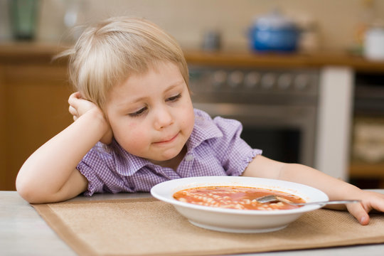 girl eating? soup