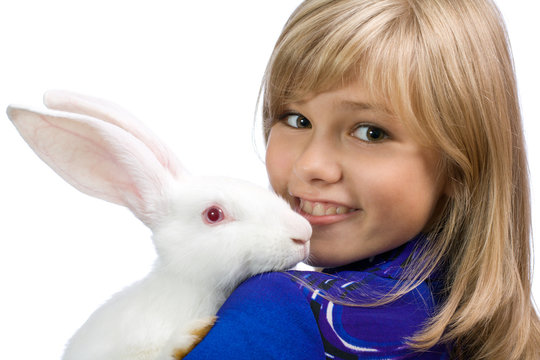 The beautiful girl with a white rabbit