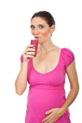 Pregnant drinking strawberry juice