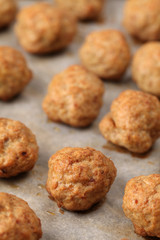 Roast meatballs on baking sheet. Shallow DOF