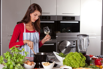 Pretty woman stirring in the pan