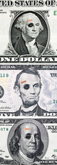 US currency with black eyes and band aid