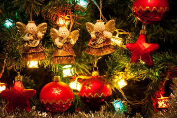 Musician angels hanging on the Christmas tree, close up
