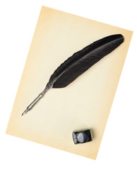 Feather quill and inkwell on an old paper