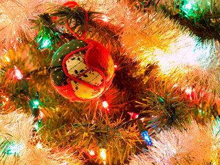 Fototapeta na wymiar Christmas Tree Holiday Ornaments Hanging on a Tree