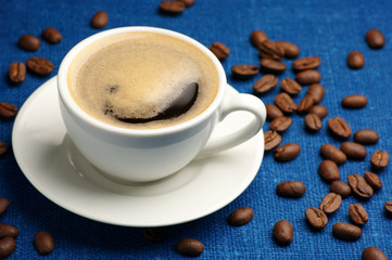 Cup of coffee and coffee beans