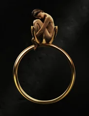 Wandaufkleber Beautiful young beauty in a golden ring © konradbak