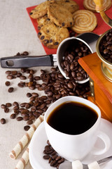 coffee pot, sweets, cup and grinder