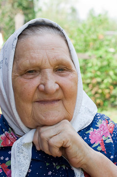 Portrait of the old woman in a scarf