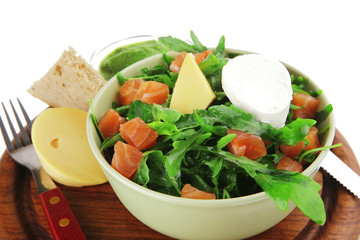 salad with salmon in green bowl