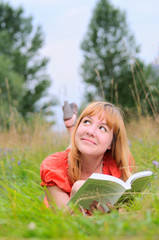 Young smiling woman dreaming