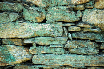 ancient stone wall with a moss