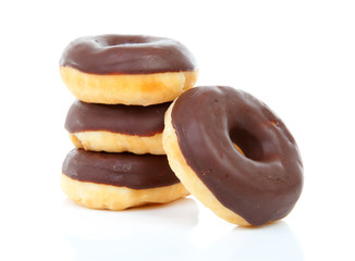 pile of chocolate donuts over white background