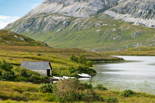 Old boathouse in scenic landscape