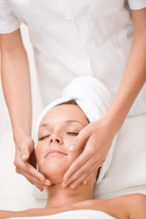 Fototapeta na wymiar Luxury care - woman at face massage
