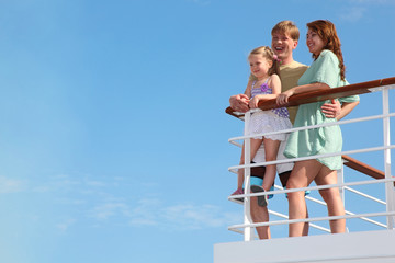 family has summer leisure in cruise on motor ship