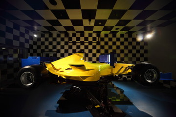 Powerful racing car inside illuminated hall