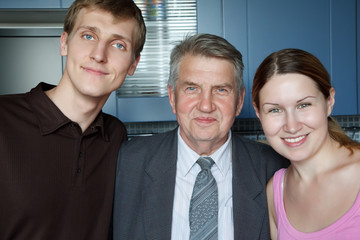 Family of three people. Man, old man and girl smiling