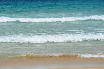 Fototapeta na wymiar Incoming Waves Hitting The Shore