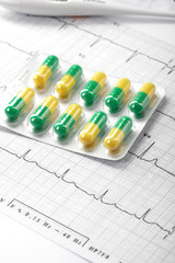 pills on the cardiogram