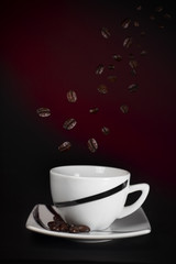 Falling coffee beans in to cup