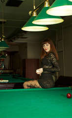 Lady in pool room