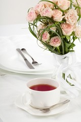 Obraz na płótnie Canvas cup of tea on holiday table