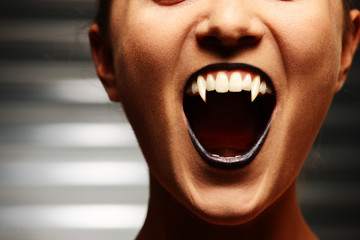 Close up of a vampire woman's mouth - obrazy, fototapety, plakaty