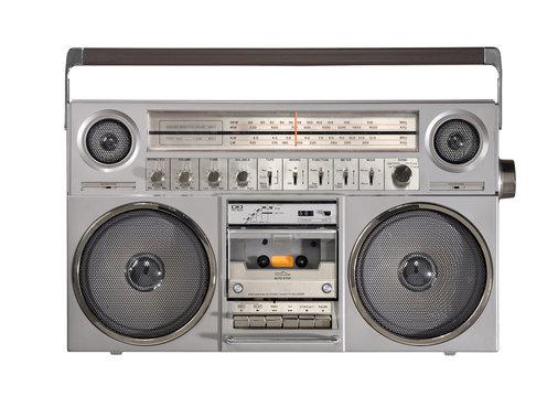 Retro outdated portable stereo boombox radio cassette recorder from circa  late 70s with aged headphones front gradient black wall background.  Listening music concept. Vintage old style filtered photo Stock Photo