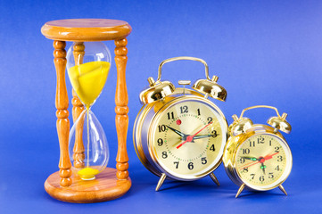 Time concept with clock and hour glass