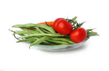 Green beans and tomatoes on white background