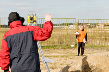 surveyor works with theodolite