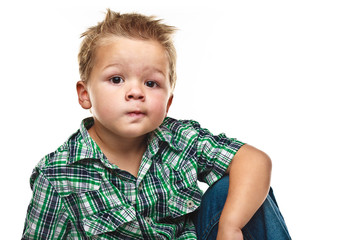 Adorable little boy looking pensive.