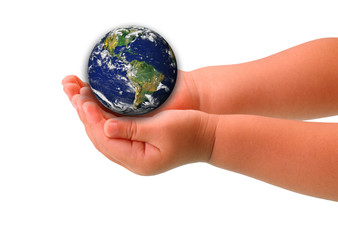 The globe in hands of the child,isolated on a white