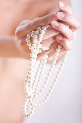 pearls in the women's hands