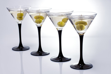 Martini with olives on a white background