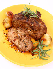 Roast pork with onions, rosemary and some colorful peppercorns
