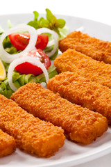 Fried fish fingers and vegetables