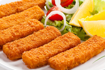 Fried fish fingers and vegetables